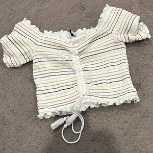 Storia Smocked off the shoulder tassel crop top